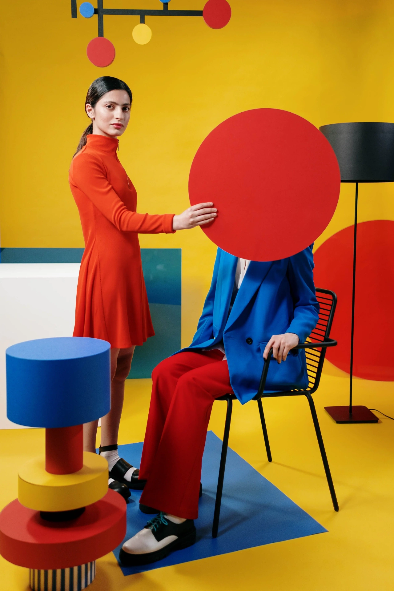 Model against a flat primary colour backdrop