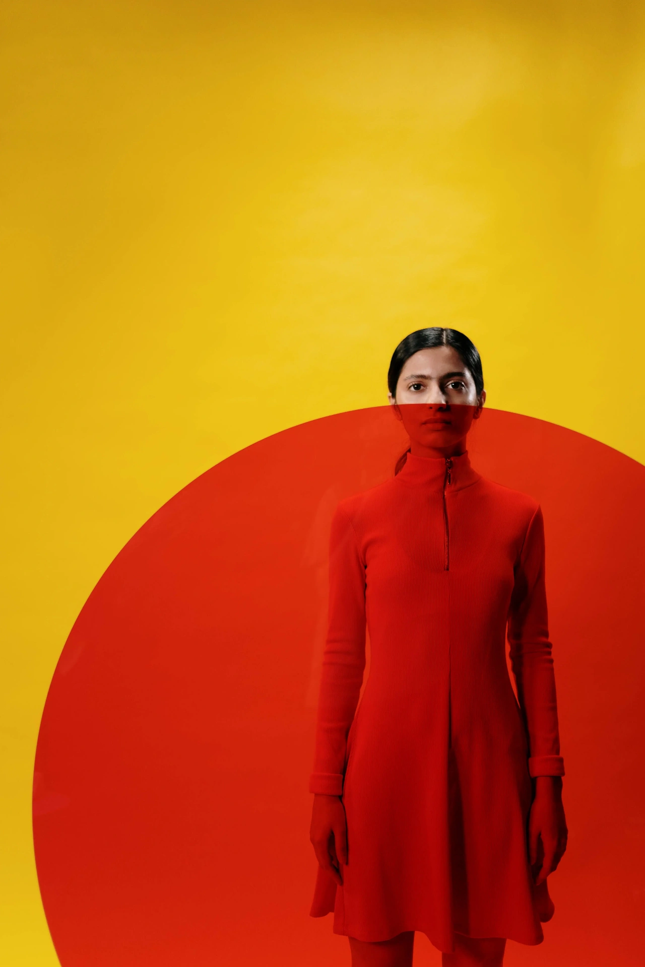 Contrasting garments read against opposing colour fields